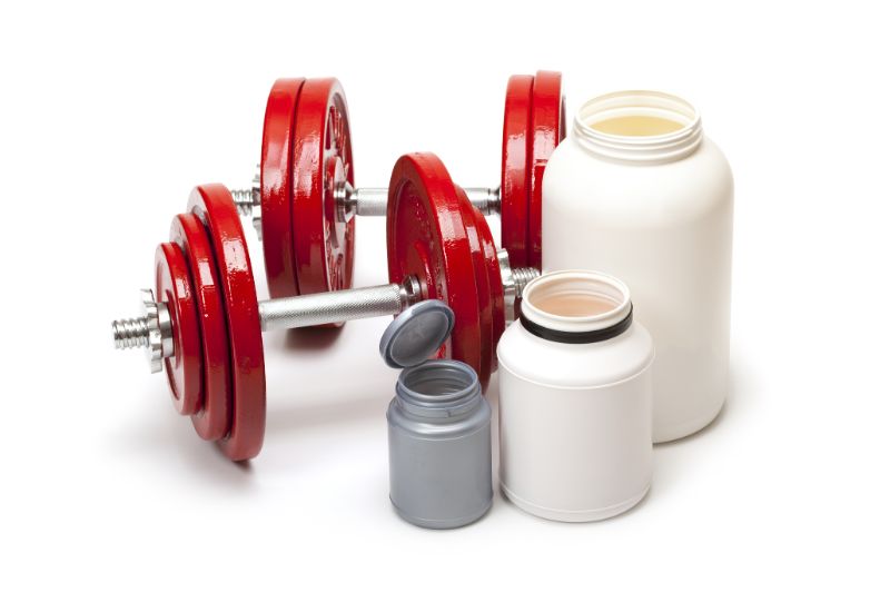 powder-for-gym-body-building-dumbbells-and-dietary-supplements-min