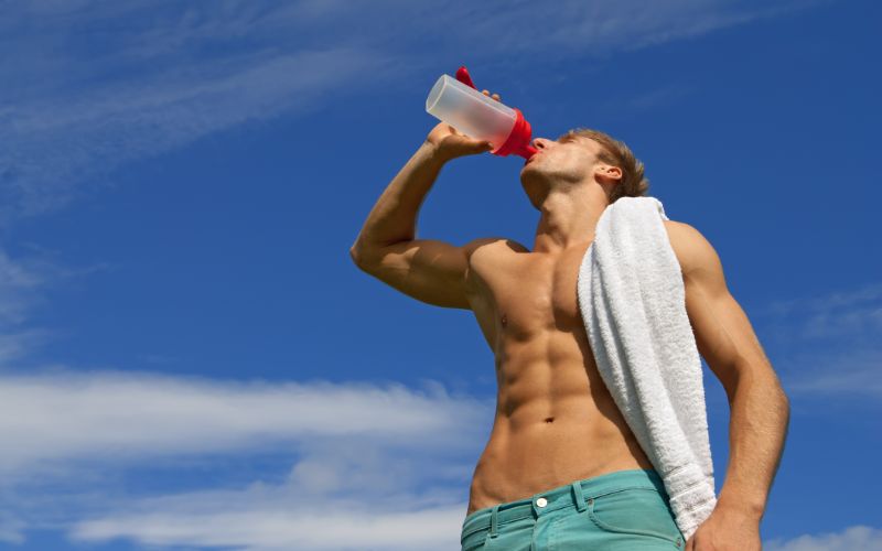 gym-protein-powder-fit-man-drinking-shake-min