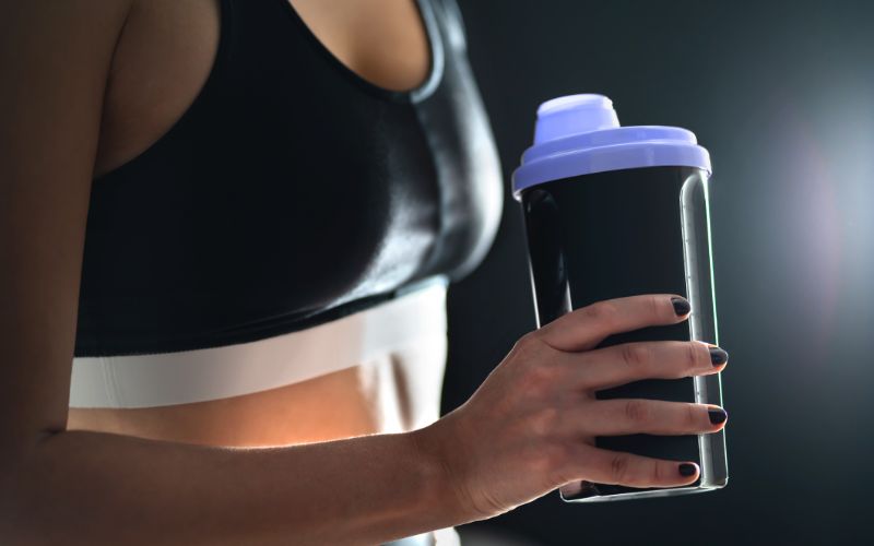 whey-extreme-woman-with-protein-shake-min