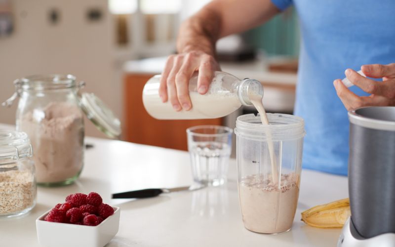 NPL-supplements-close-up-of-man-making-shake-after-exercise-min