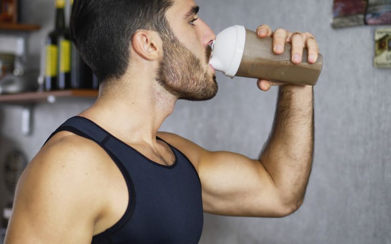 best-whey-protein-south-africa-young-man-drinking-a-protein-shake-min