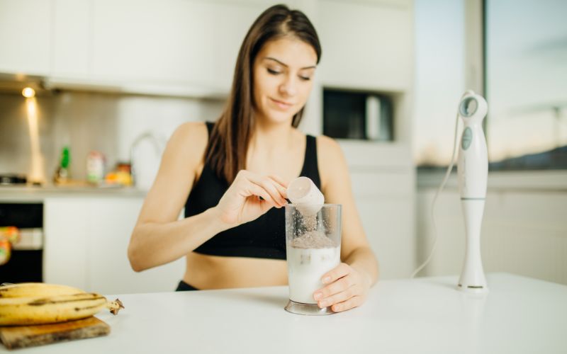 best-whey-protein-south-africa-woman-mixing-shake-min